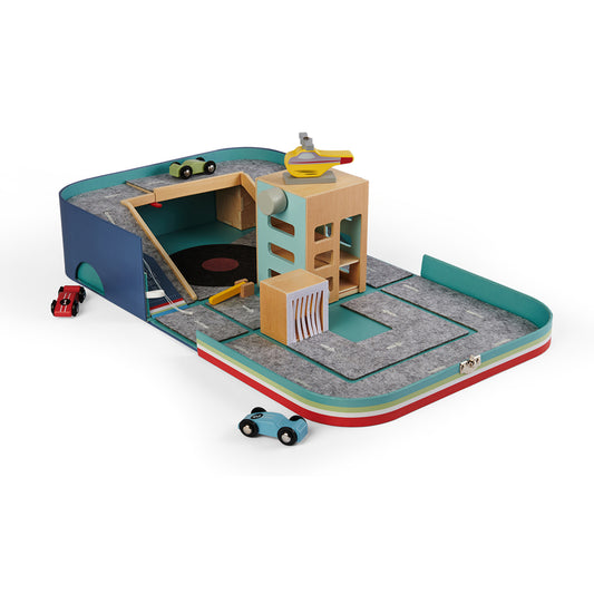 Kid's toy suitcase opened with toy cars and a helicopter